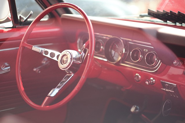 Vibrant red classic car, exuding timeless appeal and showcasing Rev Ride's diverse inventory.