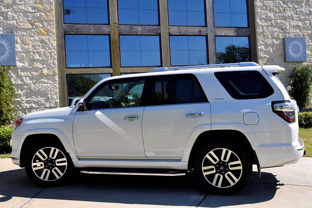 Modern white SUV, presented against a striking backdrop, symbolizing adventure from Rev Ride.